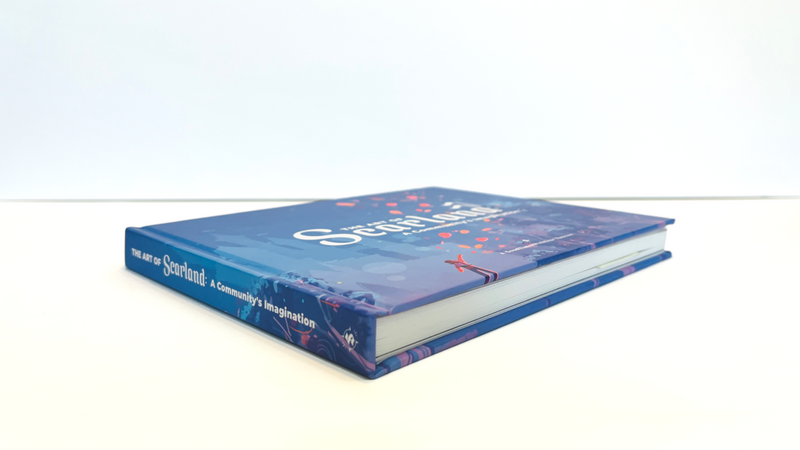 The Scarland Artbook laid flat on a white surface with a white background. The top, bottom, and spine of the book are visible. It appears to be a thick book!